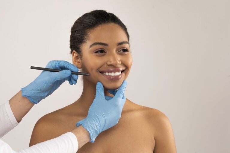 Happy young black woman getting ready before facial plastic surgery session in nyc