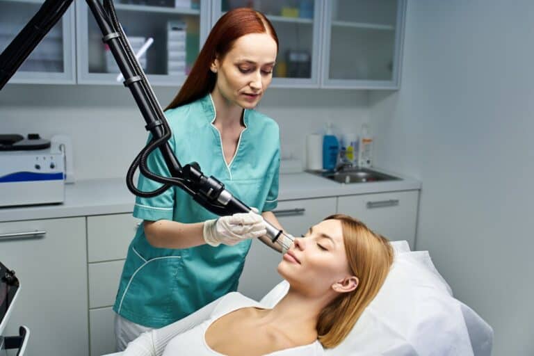 Woman at cosmetic practice getting a laser procedure to enhance youthful beauty and reduce aging sign