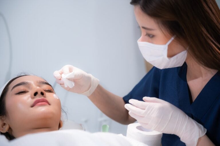 professional surgeon working at a cosmetic and plastic practice with woman patient applying non invasive treatment