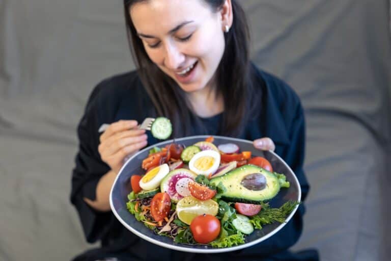 woman happy with low carb meal