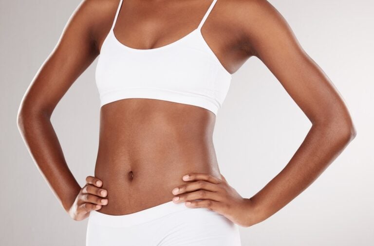 dark skinned smart lipo patient with hands on waist