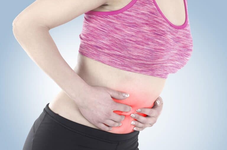 woman experiencing abdominal pain