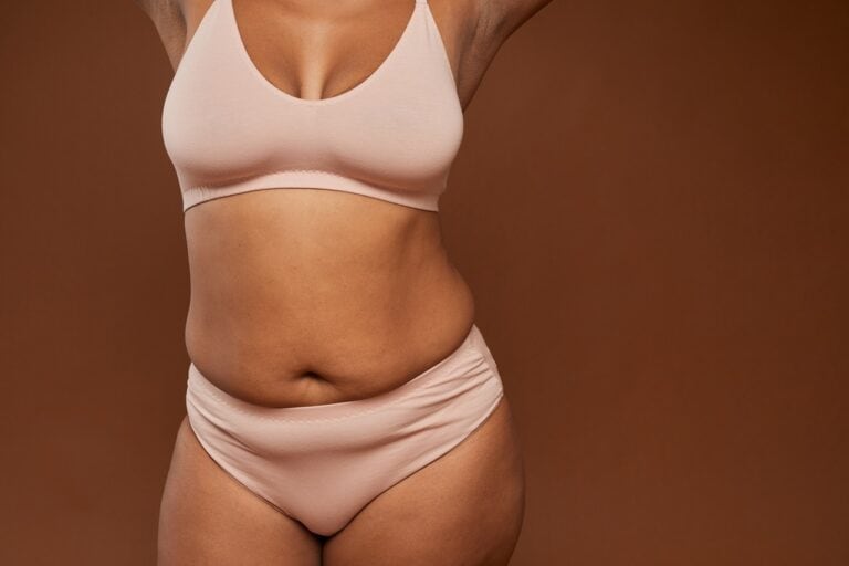 woman in brown underwear brown background
